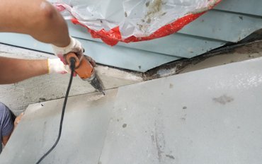 Concrete bolts are put in around the edge and hidden with flashing
