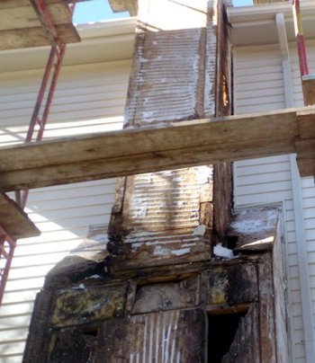 Water running down the sides of
              the chimney rotted the shoulders and the bottom