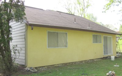 siding replaced with
              traditional stucco.