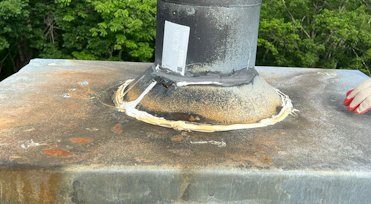 Metal pan at the top is lower in the center than the
			                sides, causing a water pool