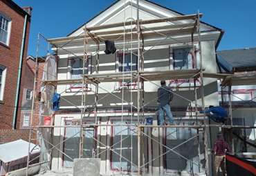 Natural cement stucco finish is left white in Alexandria, Virginia.