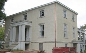 Historic stucco in Goochland County, Virginia. Finish is scored to look like block