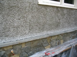 Pebble dash stucco on a new house