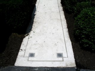 Concrete sidewalk resurfaced