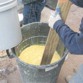 Paint colorants are mixed in  a garbage can