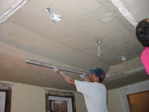 Ceiling is brown coated with sand plaster