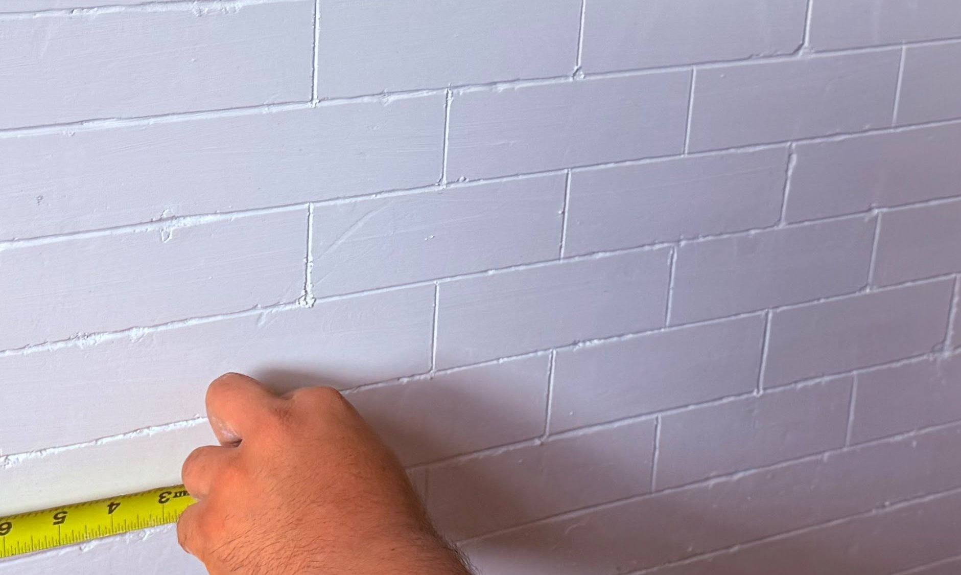 Plaster scored to look like tile in Arlington, Virginia