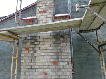 Chimney was victimized by spalling brick and sloppy patches