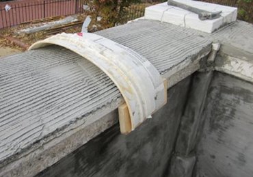 tool from a bucket to round the tops off