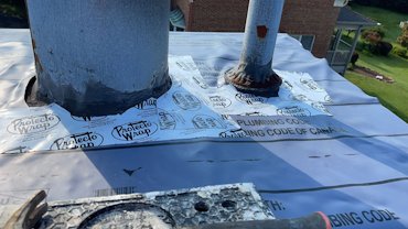 Top of chimney is covered with a rubber shower membrane.
