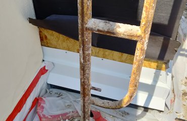 Metal flashing is put over the edge of the rubber membrane roof.