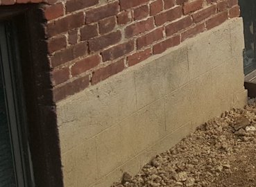 Stucco on the bottom of the existing house was scored to look like block