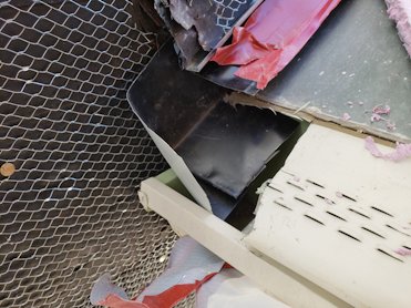 Holes are cut into the gutter helmet and  kick out flashings