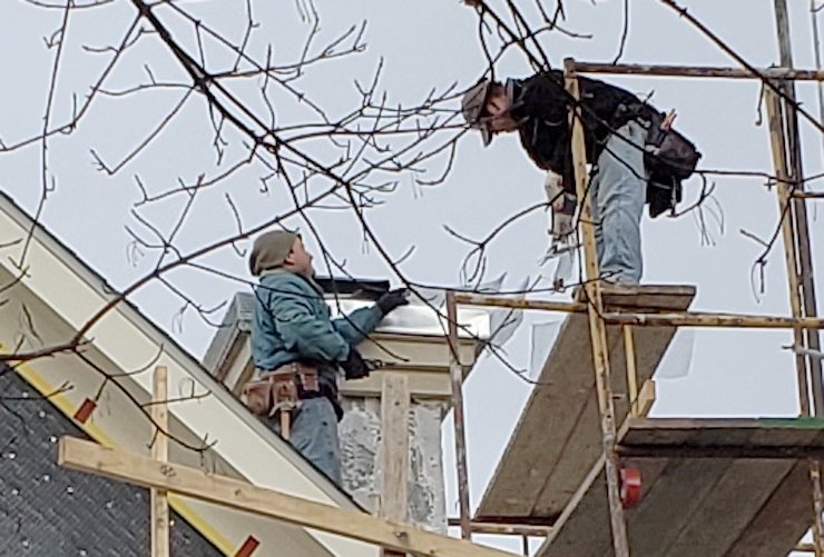 Cheap looking metal cap is covered with lath and cement mortar.
