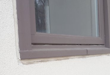 EIFS traps water against windows cause them to rot and distort in Bethesda