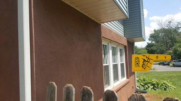 Stucco on spalled brick in Manassas, Virginia