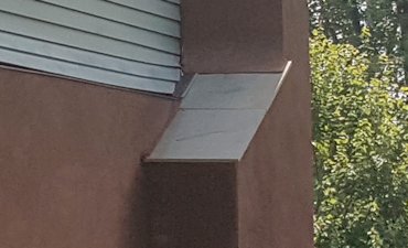 chimney with a flagstone chimney shoulder.