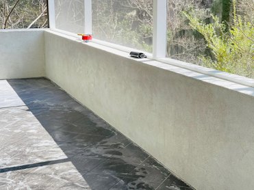 Enclosed porch had a nice rough white stucco finish.