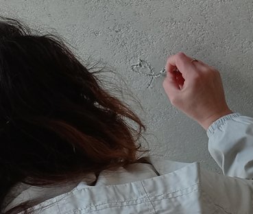 designs are scratched in the wall