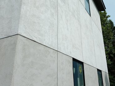 The panels are defined using aluminum channel screeds in McLean, Virginia.