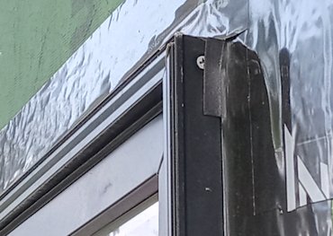 window angles water into wall