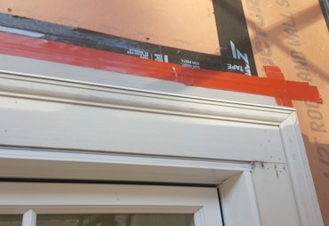 Flashing is put over windows and sealed