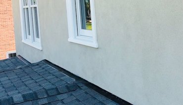 Apron flashing on roof is overlapped with our weep stop.