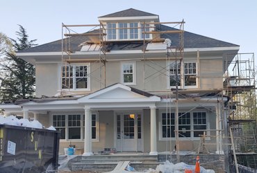 New stucco house looks appropriate in this old neighborhood in Washington, DC.</