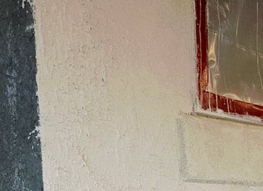Top of the sill is angled down with white mortar.