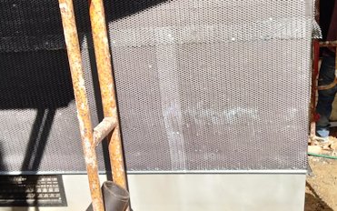 Plaster stop over the foundation has weep holes.