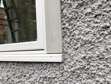 No ugly gob of caulking around the window.