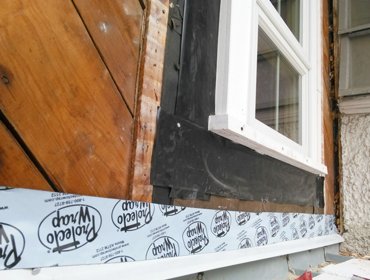 Rubber membrane seals the windows and flashing.