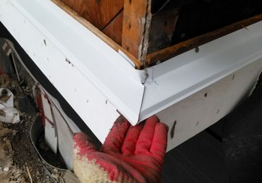 Flashing is put over the wood drip molding.