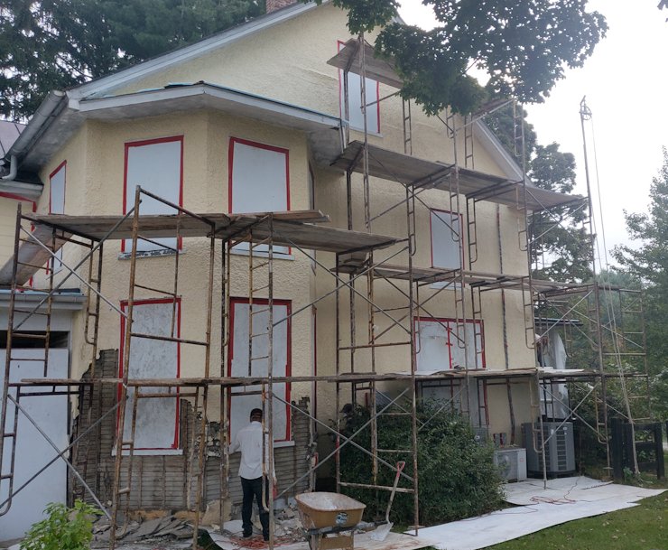 1930's stucco is stripped off in Paeonian Springs, Virginia