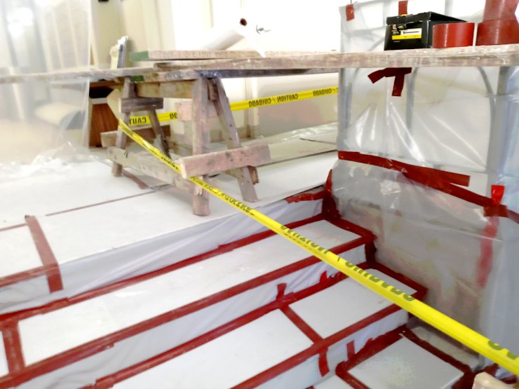 Floors are protected with a layer of plastic.