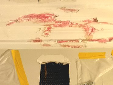 Loose areas are chopped out and painted with plaster weld.