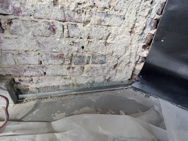 Mortar scraped off the brick easily.