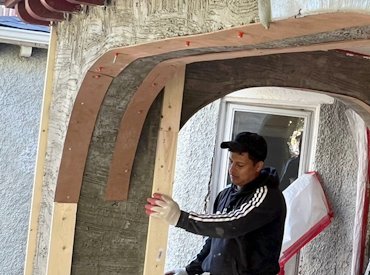 Soffit vents are put in the stucco soffits.