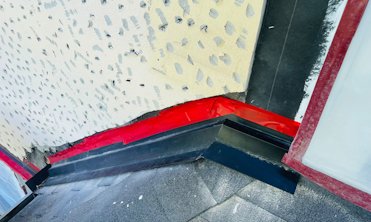 Step flashing was covered with counter flashing.