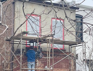 Townhouse in Northeast Washington had a mix of old sloppy stucco.