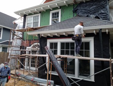 Pebble dash stucco replaced on this 1915 house in Washington, DC.