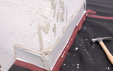 flashing is over the stucco and not behind the stucco.