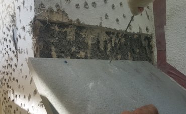 Flagstone for the shoulder is drilled for bolts