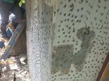 Loose areas are knocked off.