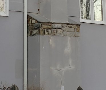 Cracks show stains where water is coming out of the wall.