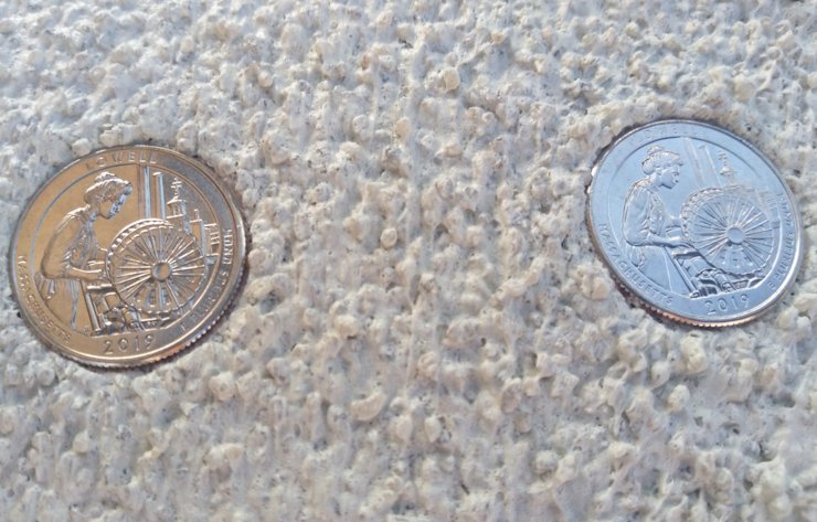 embedded in the top of the chimney are 2019 Lowell quarters.