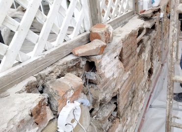 deteriorated terra cotta block wall