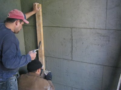 Stucco scored to look like stone
                blocks