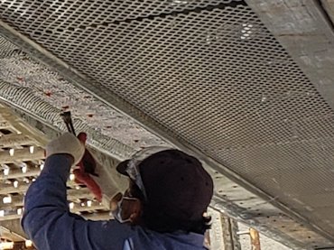 Lath is shot to beam using ramset pins.