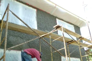 The windows and even the soffits are covered with plastic and tape